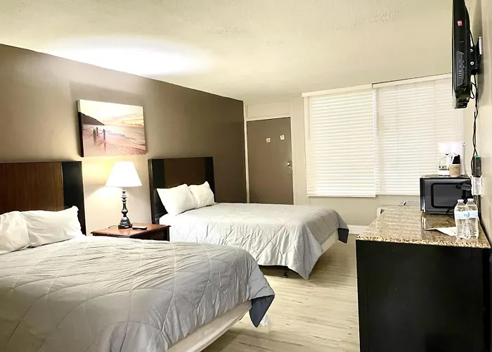 Apm Inn & Suites